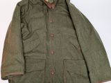 the jacket is green and brown with a brown lining
