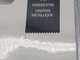 a black label on the side of a white car