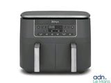 a close up of an air fryer on a white background