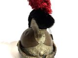 a stuffed animal sitting on top of a helmet