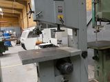 two machines that are sitting on a pallet in a warehouse
