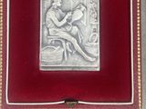 an image of a picture of a woman sitting on a bed in a red box