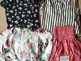a box filled with three different types of clothes