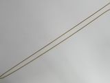 an image of a gold chain with a diamond on it