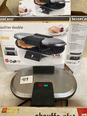 a box of waffles sitting on the floor next to a box of waffles