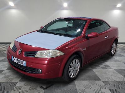 a picture of a red car parked in a garage