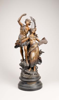 an image of a bronze statue of a woman playing a harp
