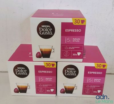 three boxes of coffee sitting on top of each other on a table