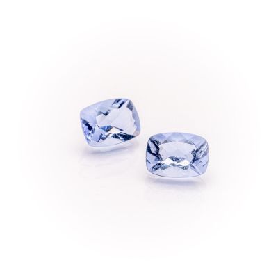 a pair of blue sapphires on a white background