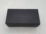 an empty black box sitting on top of a white table