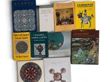 a lot of books that are sitting on a table