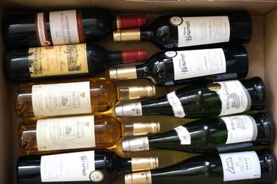 many bottles of wine in a box on the table