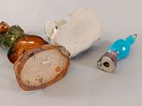 a small vase and a small toothbrush on a table