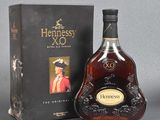 the bottle of hennessy xo is next to the box