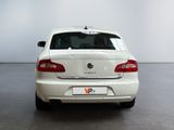 a white car that is parked in a room