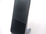 a cell phone that is sitting on a stand