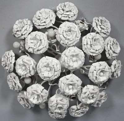 many white flowers that are on a gray surface