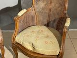 pair of cane back chairs with cushions