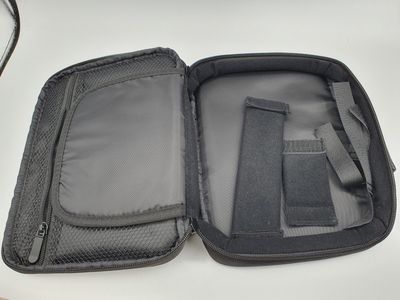 a black case with a zipper on the inside of it