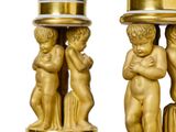 two gold vases with cherenshes on them