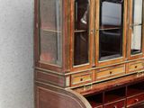 a small desk with a mirror on top of it