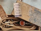 a wooden box with a bunch of electrical cords in it