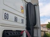 an image of a truck with a hose attached to the back of it