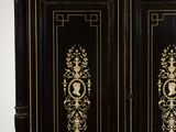 a black and gold cabinet with two doors on it