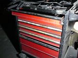 an image of a red tool box with tools in it