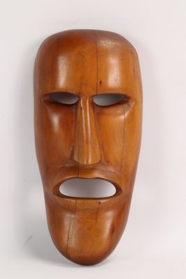 an image of a wooden mask on a white background