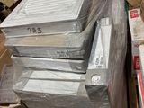 a pile of electronic equipment sitting on top of a pile of boxes