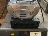 a radio that is sitting on top of a stack of electronics