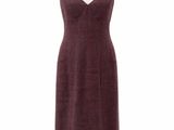 a dress on a mannequin stand with a white background