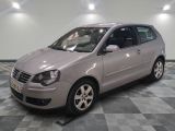 a picture of a silver car parked in a garage