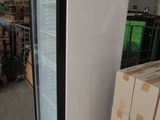 a refrigerator that is sitting in the middle of a warehouse