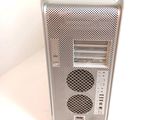a silver computer tower sitting on top of a white table