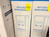boxes of hot and cold water dispensers stacked on top of each other