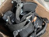 a cardboard box full of shoes that are sitting on the floor