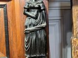 a statue of a woman holding a baby in her arms