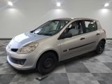 a picture of a small silver car parked in a garage