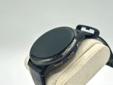 a smart watch sitting on top of a display case