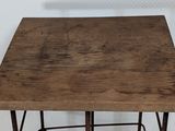 a small wooden table with metal legs and a wooden table top
