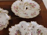 three plates that are sitting on top of a wooden table