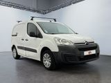 the white van is parked in a large room with a roof rack