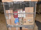 a man standing next to a cart filled with boxes