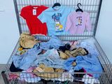 a metal cart filled with clothes and clothing items
