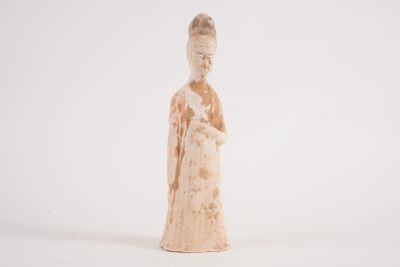 an old figurine of a woman holding a baby in her arms