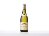a close up of a bottle of wine on a table