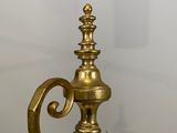 an antique brass oil lamp on a glass table