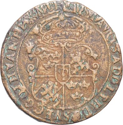 a close up of a coin with a coat of arms on it